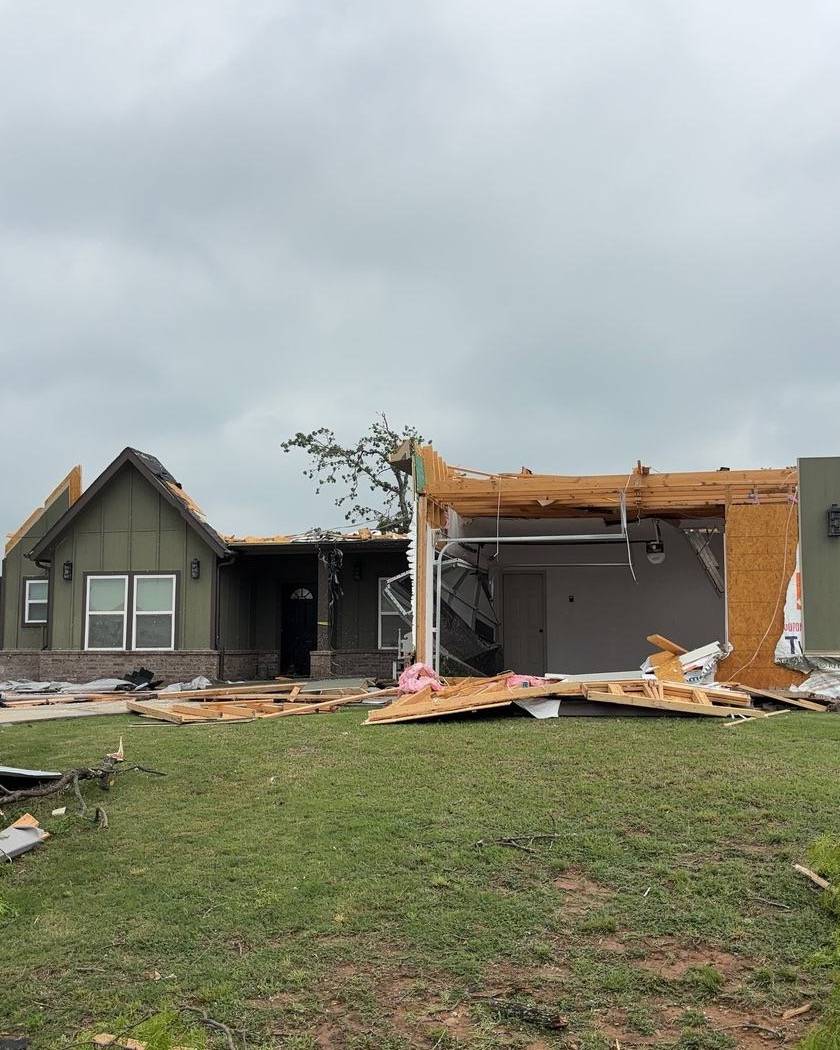 Home with most of its roof torn off by a tornado